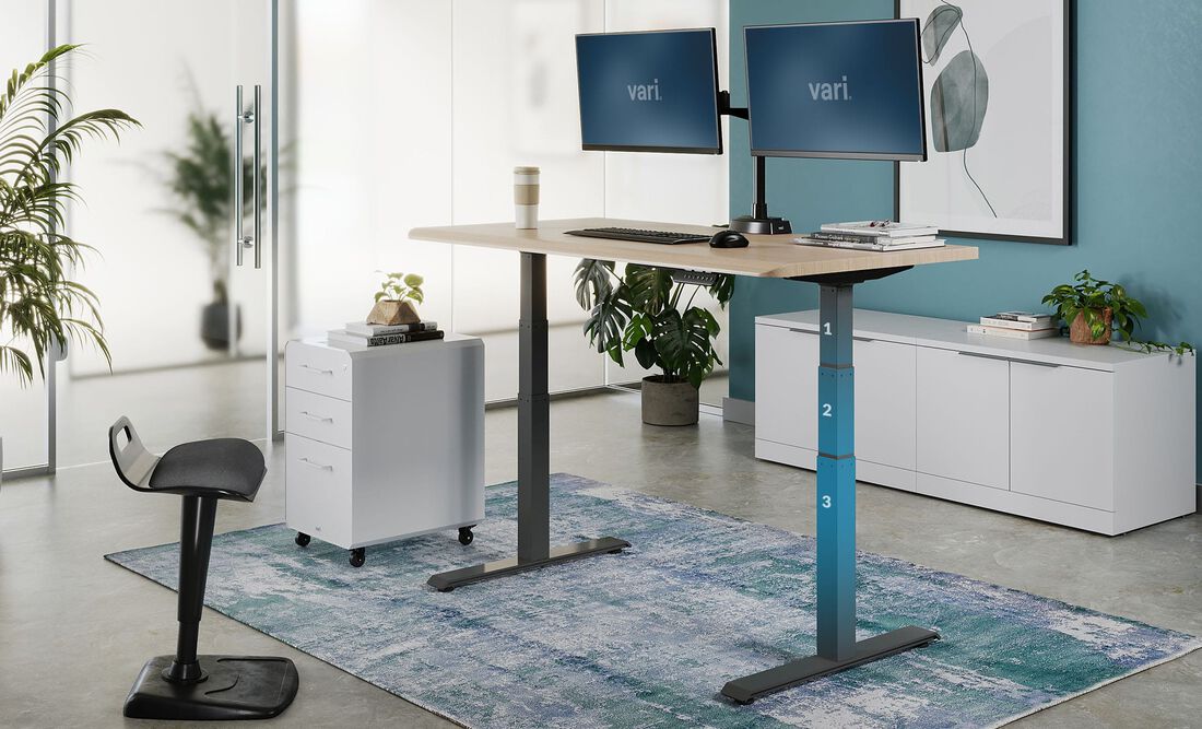 sit to stand desk with 3 tiers of heights, between 25" and 50.5"