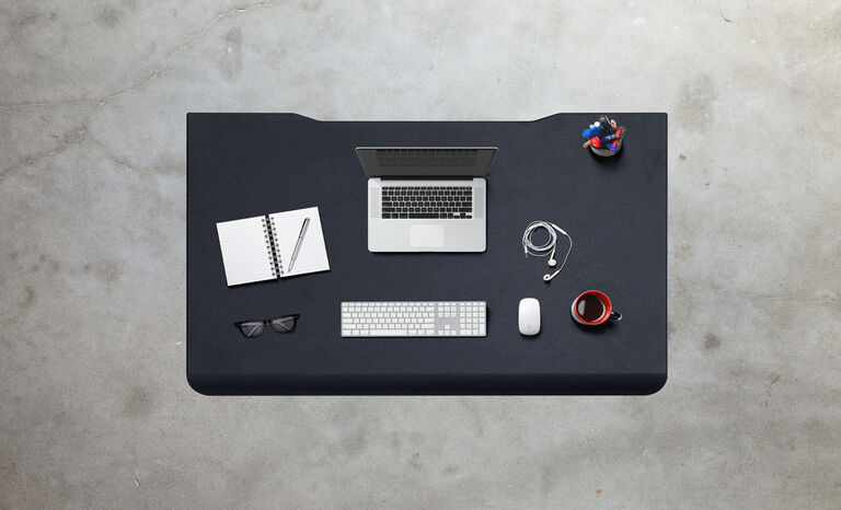 L-Shape Electric Standing Desk setup in an open workspace
