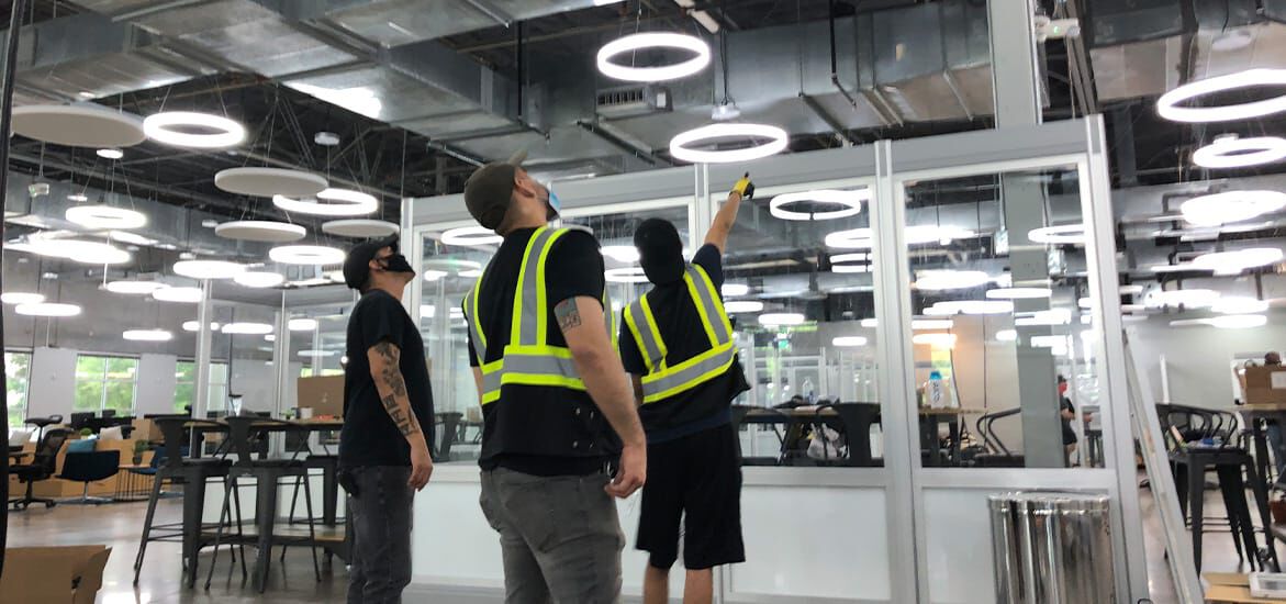 3 vari employees installing Quick Flex walls