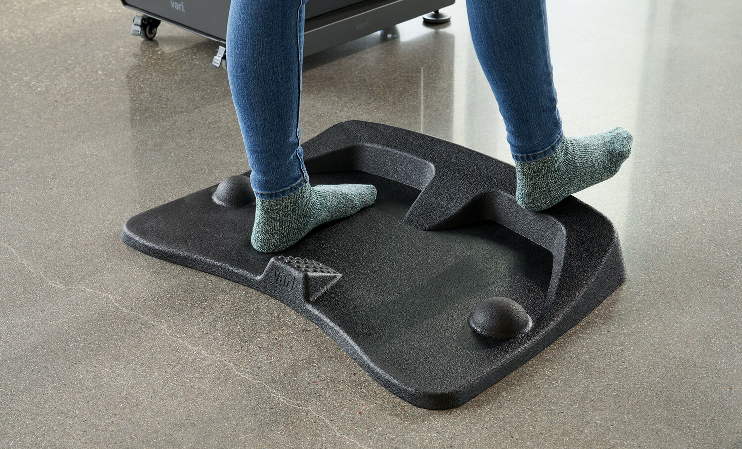Individual standing on the ActiveMat with socks on