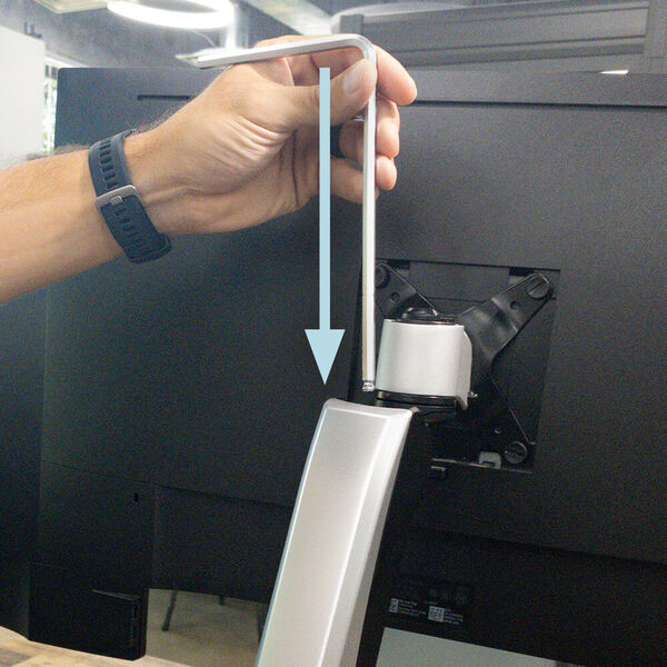 inserting allen wrench to adjust tension
