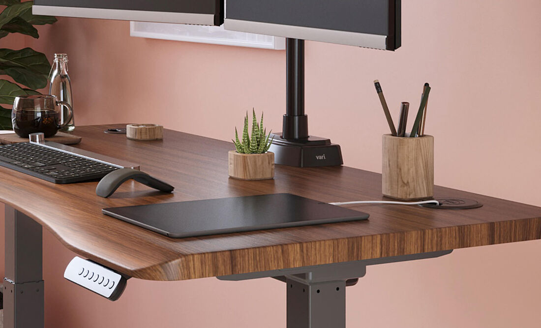close up view of the ergo electric standing desk with desk accessories