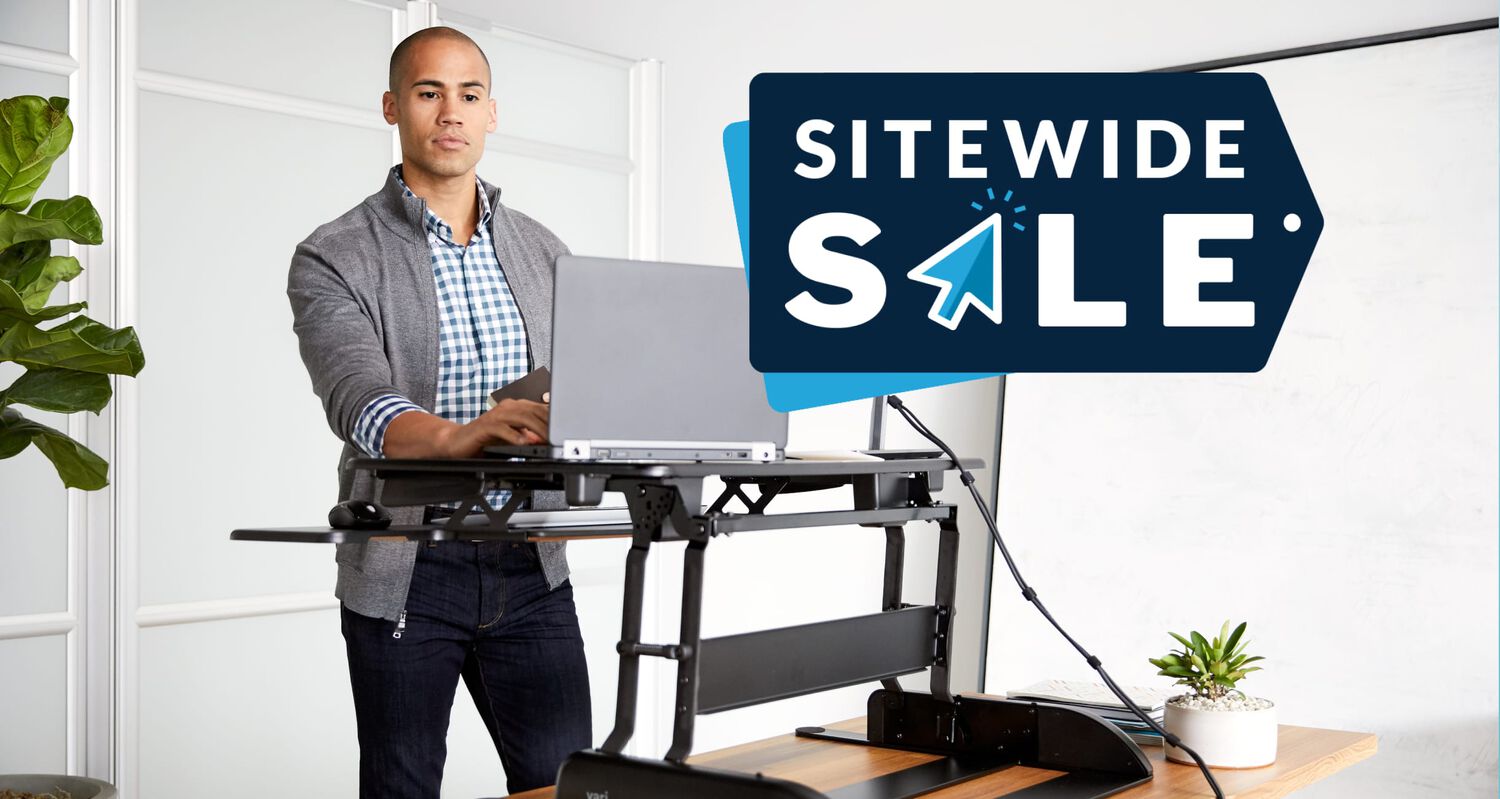sitewide sale individual working at a raised converter in an office setting 