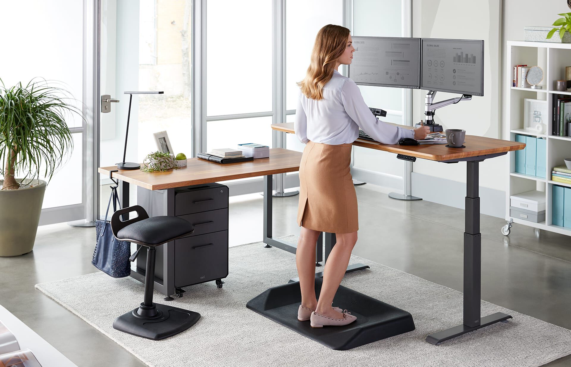 Professional working in office with Vari LED Task Lamp