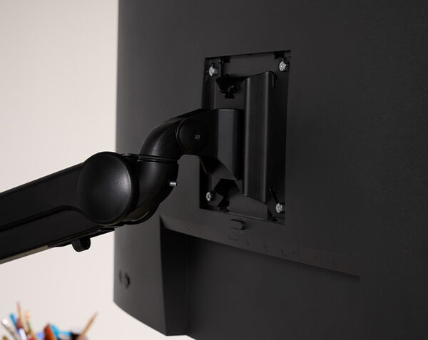 monitor attachment hardware seen from back, with the four hand tightened screws