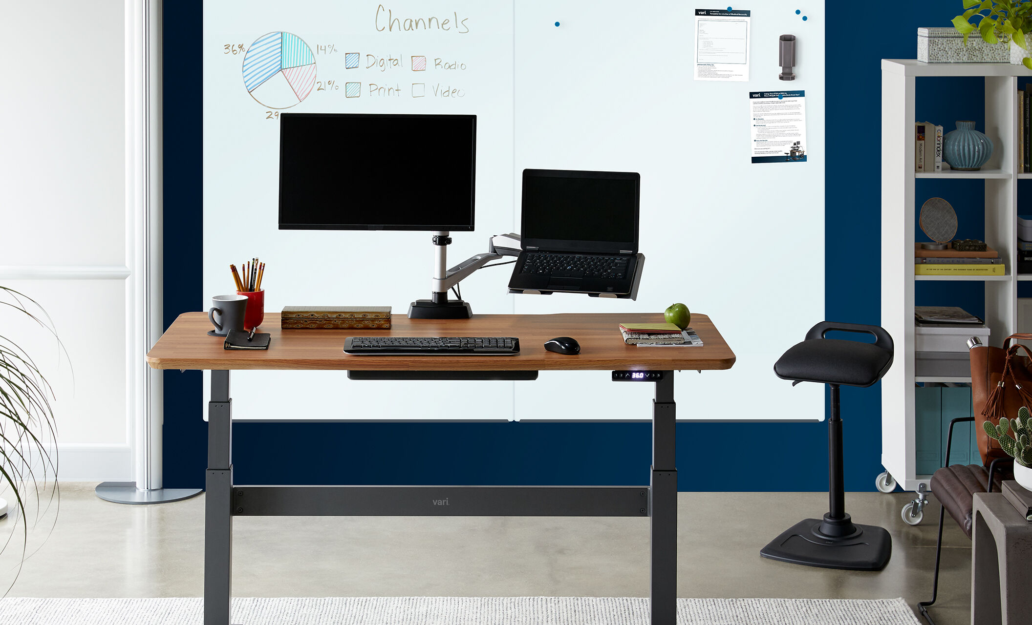 vari glass board mounted in office furnished with vari products