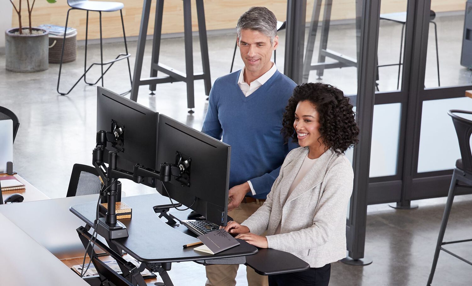 individuals using desk and Vari Dual Monitor arm 180 degree