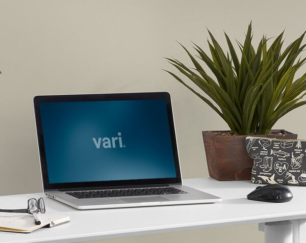 laptop on essential electric standing desk 48x24