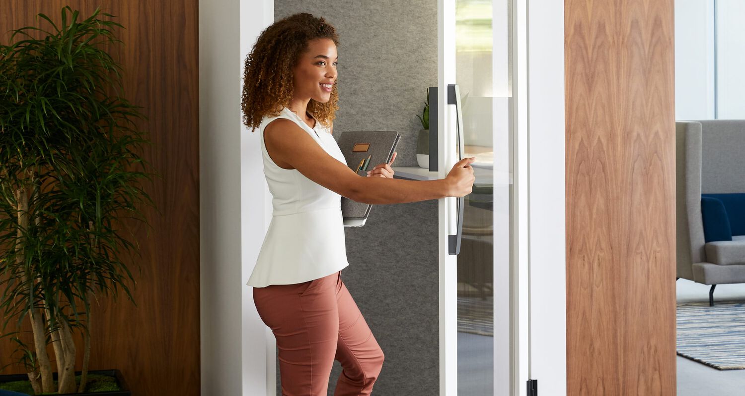 professional entering privacy booth
