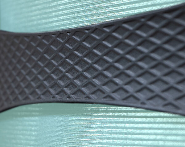 person sitting on ascent chair with closeup of lumbar support