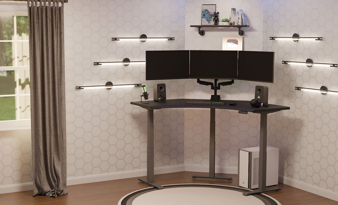 A modern home office setup featuring a corner desk with three monitors, ambient wall lighting, speakers, and a gaming PC on the floor, all in a clean, minimalistic space.