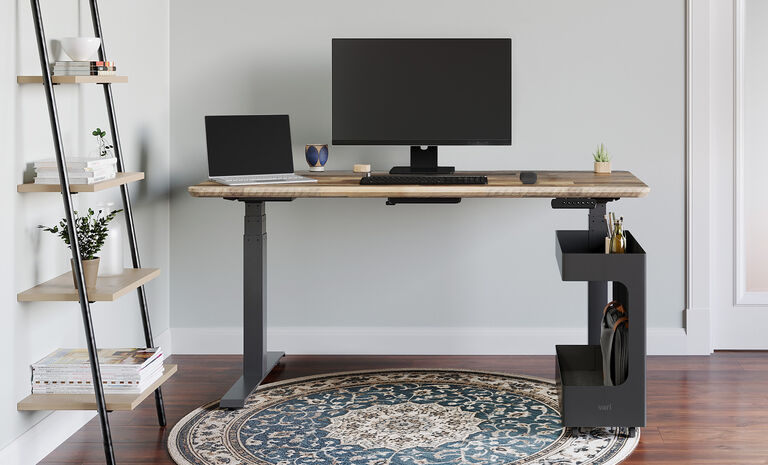 mobile cubby beside a vari electric standing desk
