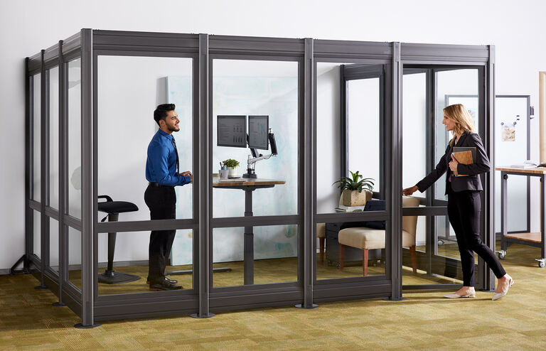 2 professionals speaking in private office space