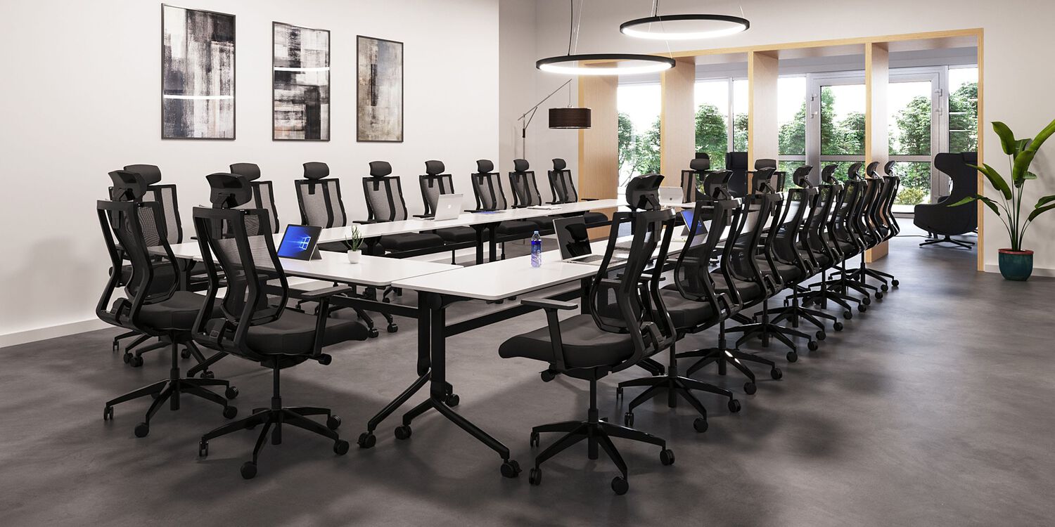 meeting room with tables and chairs facing each other
