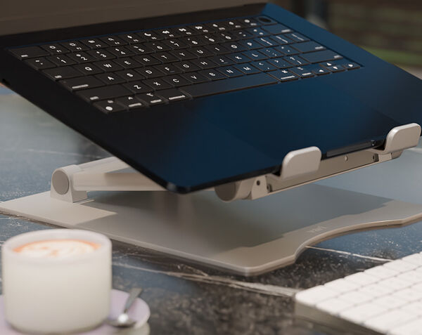 close up view of a laptop sitting on the varidesk laptop stand