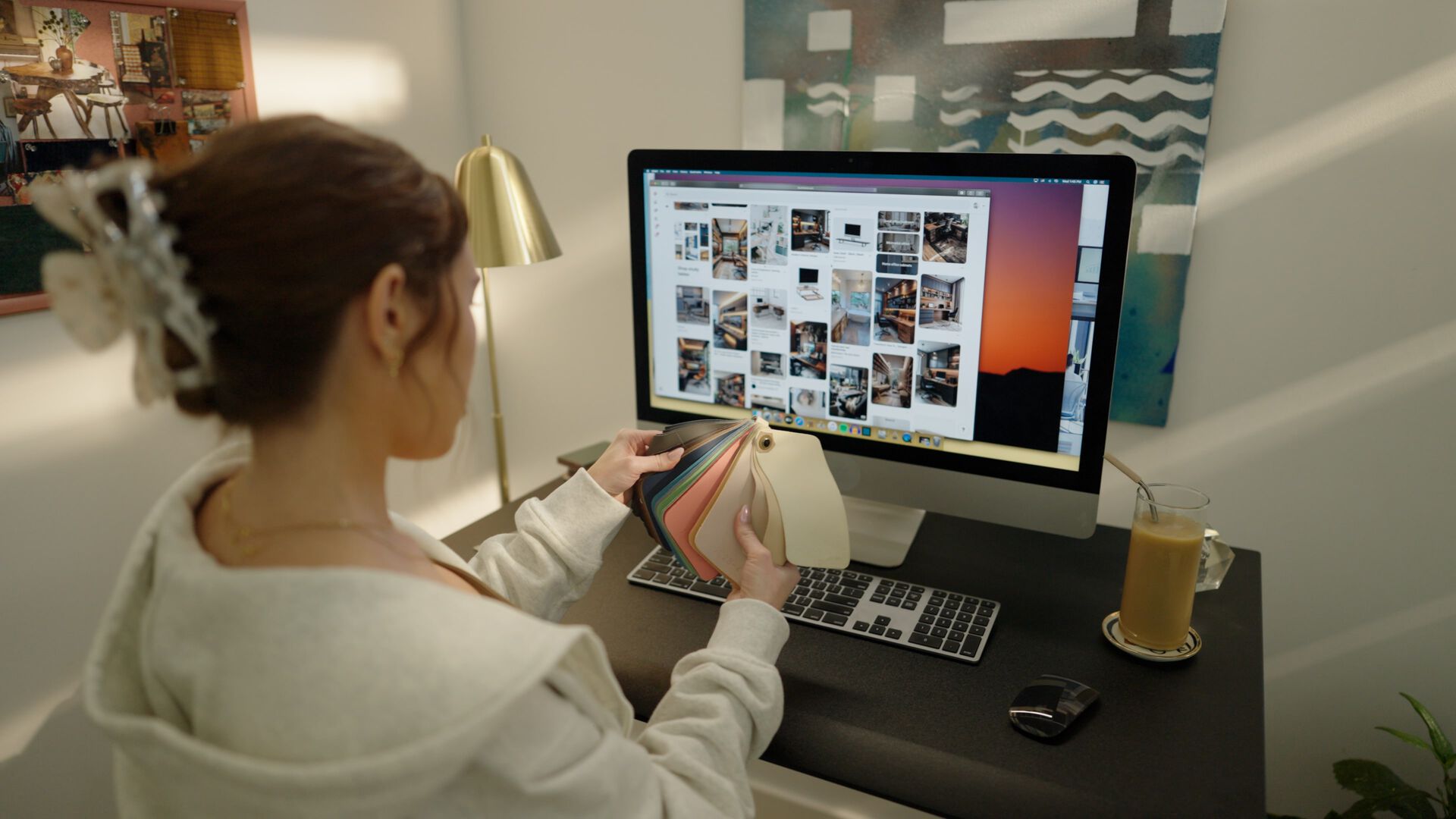 individuals working at different workspaces in their homes with different electric standing desks