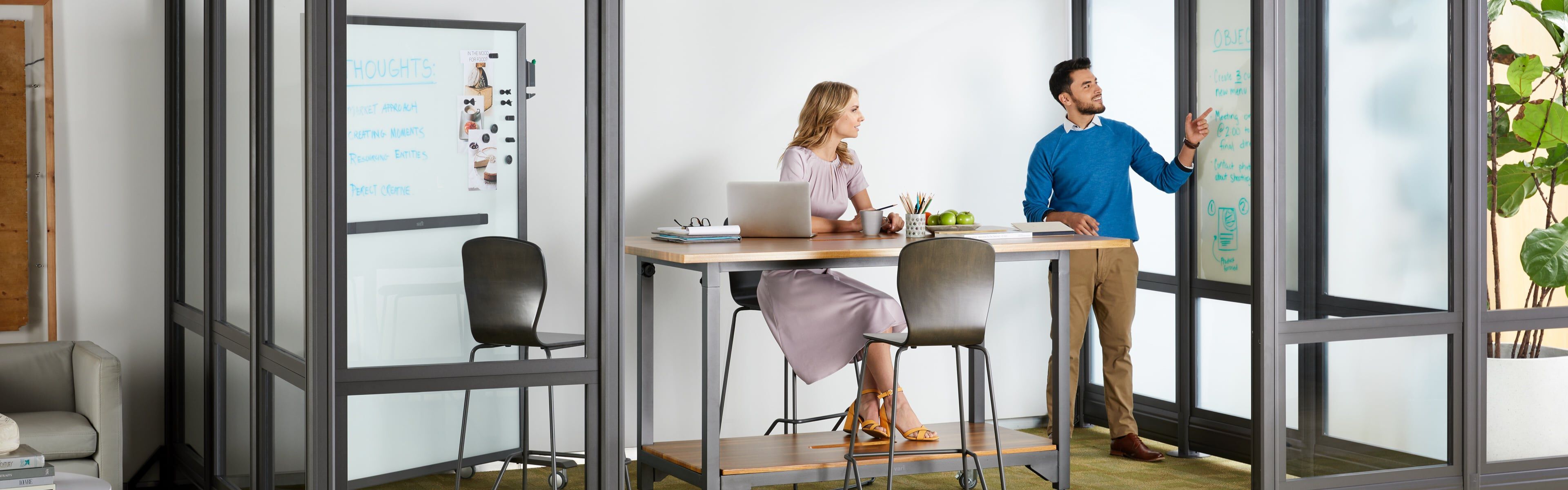 2 professionals meeting in a conference room with Vari products