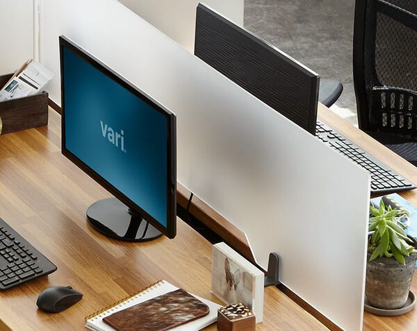 Acrylic in panel separates desks while still letting in light