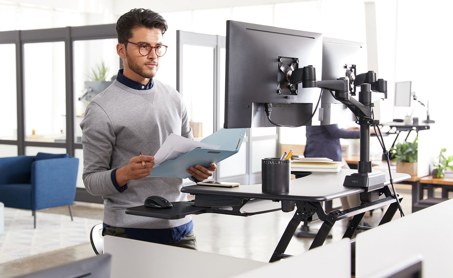 VariDesk sit-stand desktop converters in use