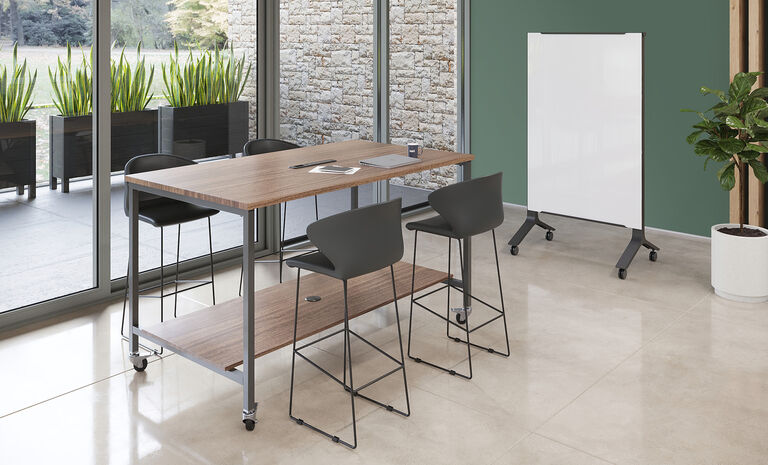individuals in conference room with vari standing conference table