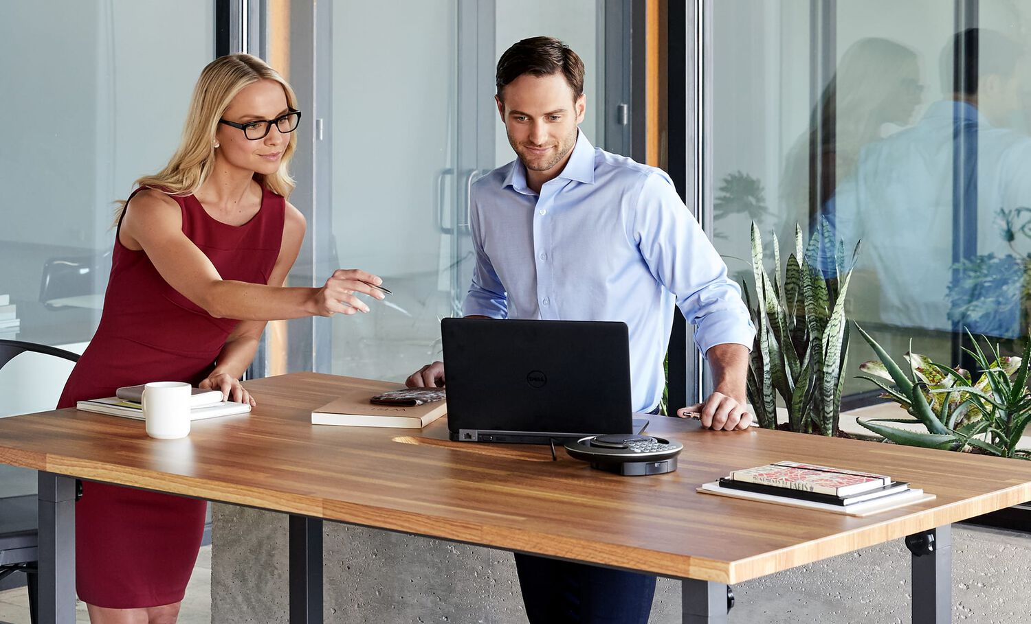 individuals using vari standing conference table
