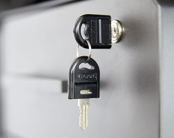 keys hanging from lock in top drawer