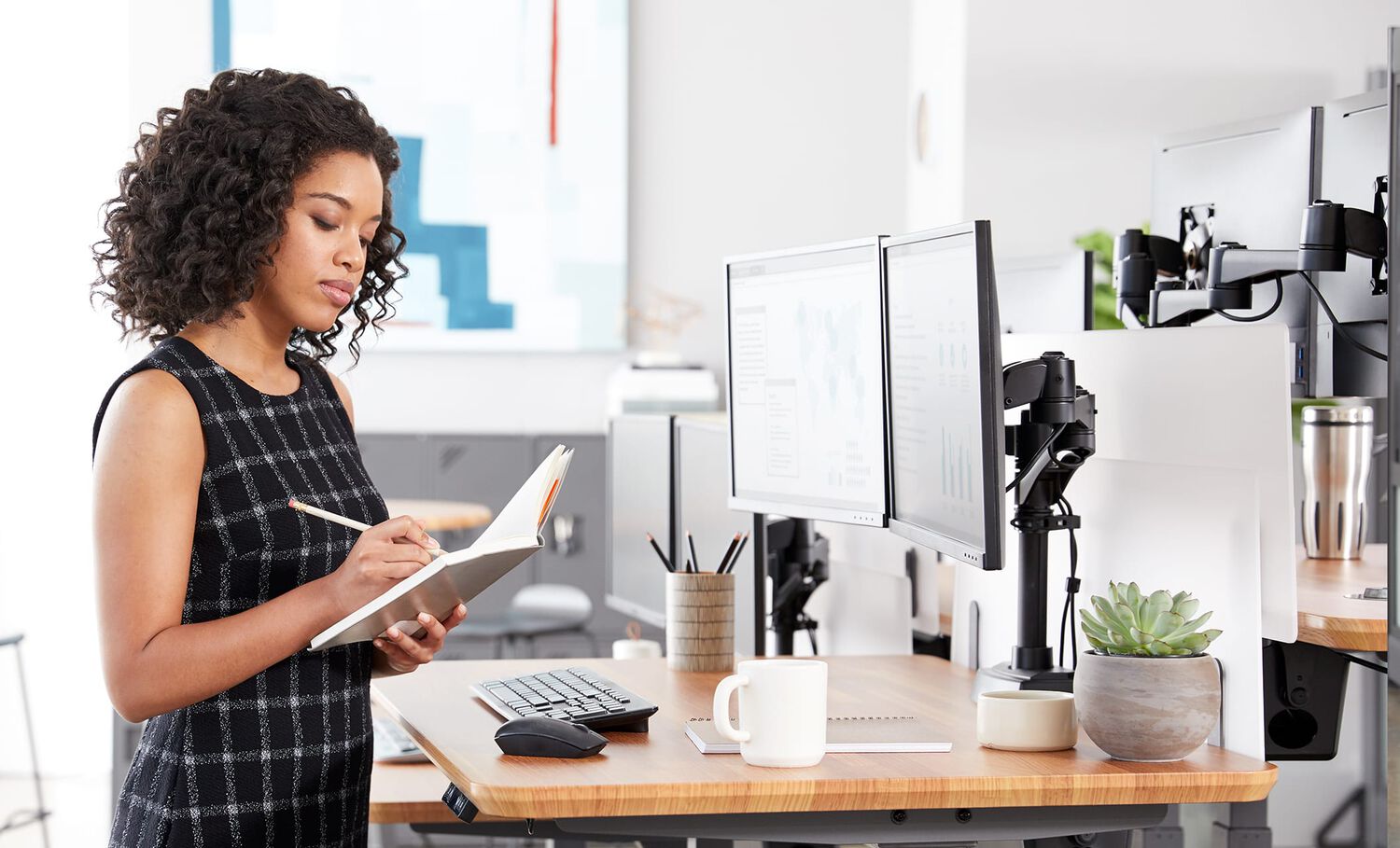 Individual working in office with Vari products