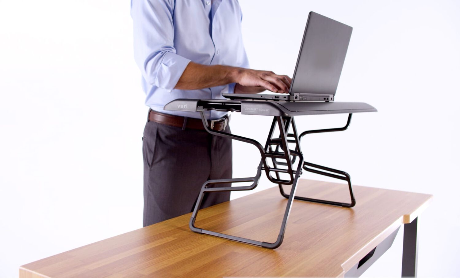 Individual using varidesk laptop 30 in standing position