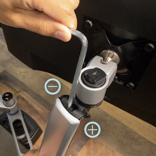 adjusting tension bold to adjust arm tension