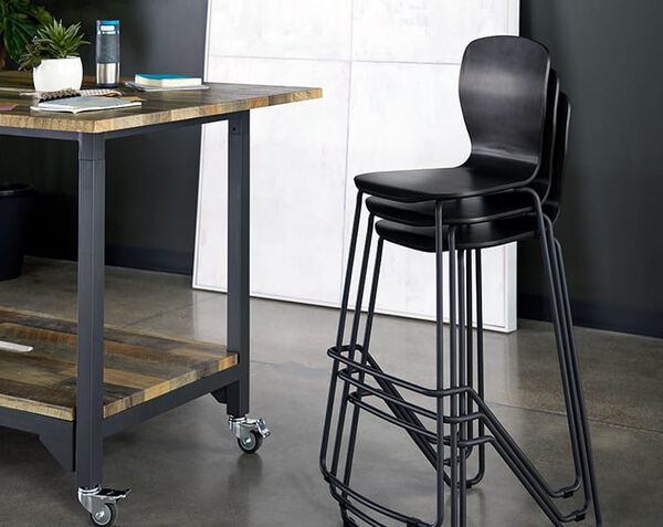 chairs seen stacked in office three high