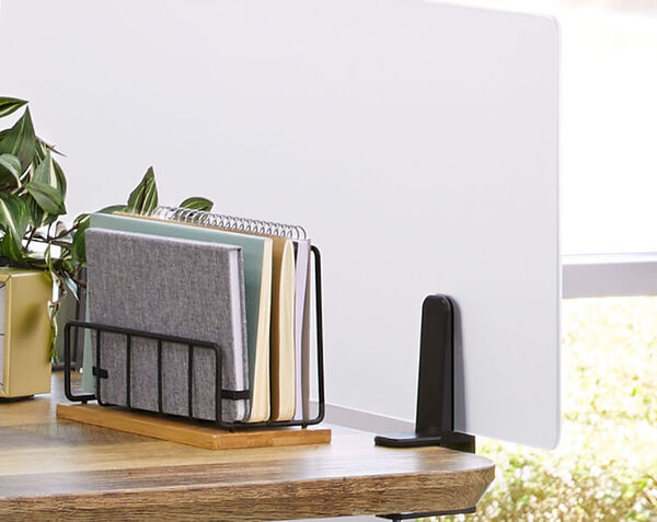 Acrylic in panel separates desks while still letting in light