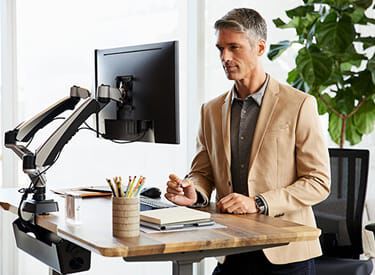 vari electric standing desk in use