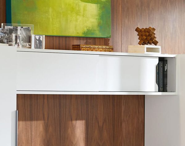 executive overhead cabinet shown mounted onto wardrobes for elevated storage