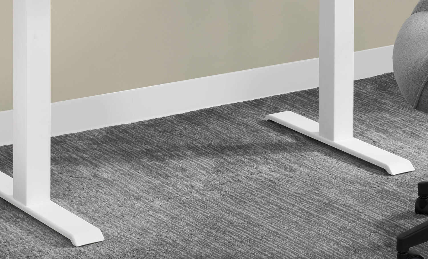 closeup of legs and feet of the essential electric standing desk 48x24