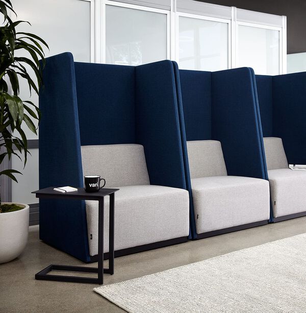 tall private sitting areas next to one another in a lobby setting