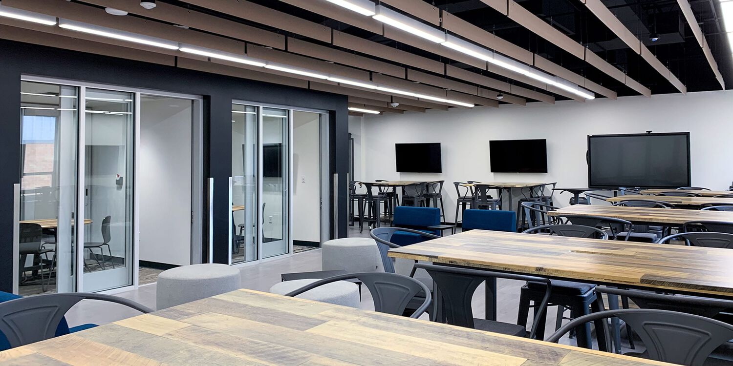 group meeting tables with chairs in an open space