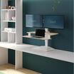 varidesk electric dual monitor converter in light wood in a raised position on desk 