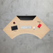 overhead view of a command center electric standing desk with a light wood desktop