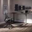 performance home office set made up of curve electric standing desk 60 by 30, performance task chair, dual monitor arm, standing mat 34 by 20, power hub, and power strip 8 foot