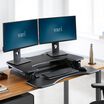 VariDesk Pro Plus 36 Black sit-stand desk converter lowered in office 