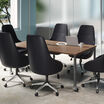 walnut conference table in workspace