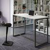 standing work table in white finish setup in an open workspace environment with an active seat and laptop in use on top of the table