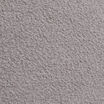 Extreme close-up of light gray boucle upholstery fabric, highlighting its dense, looped texture.