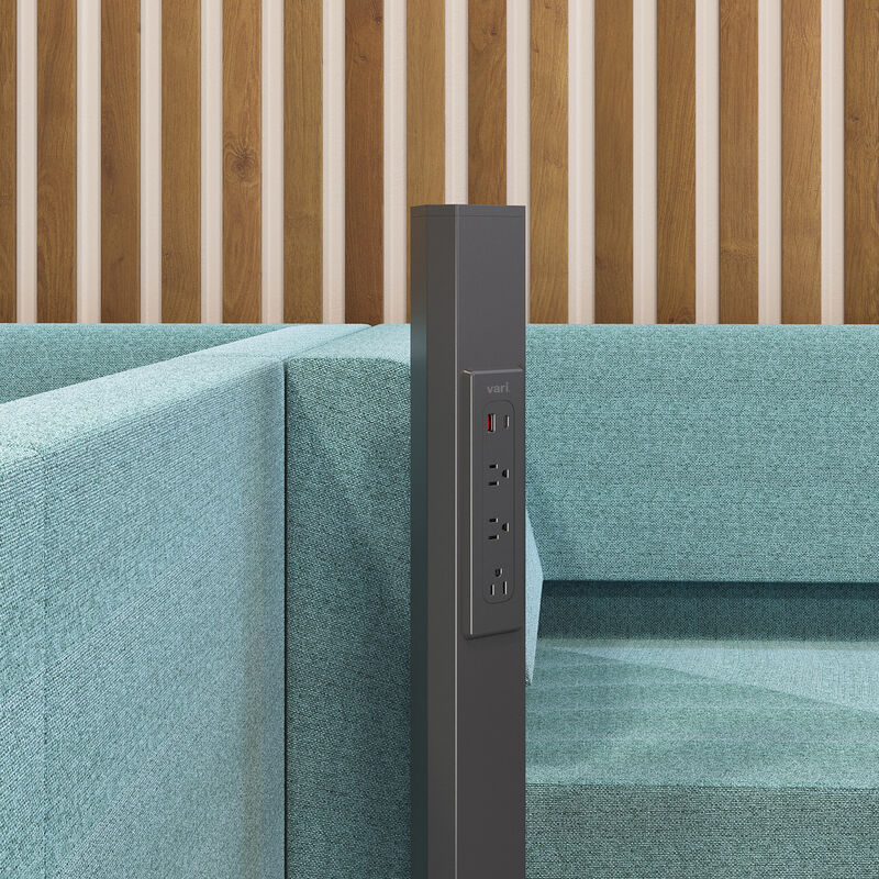 close up of the three ports and one USB-A port and one USB-C port on the charging station used in an open workspace image number null