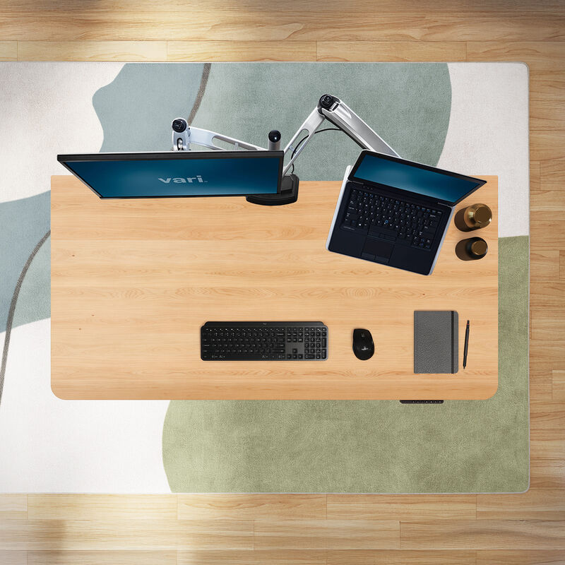overhead view of a solid wood white oak finish with office tools on top of it image number null