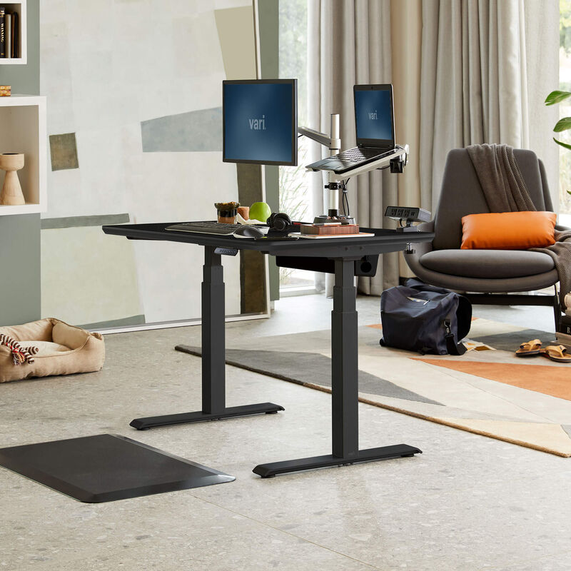 Electric Standing Desk 48x30 Black in lowered position at home  image number null
