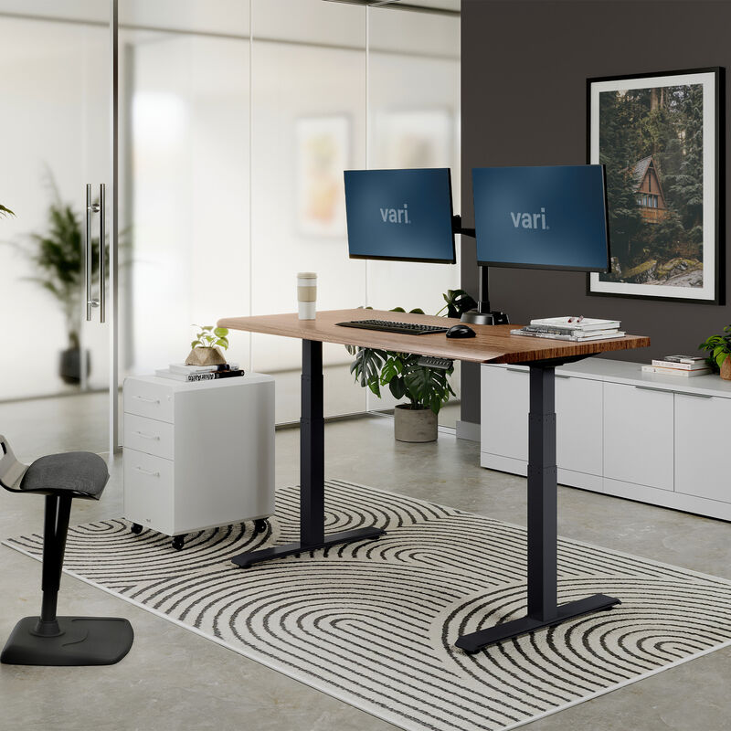 Electric Standing Desk 60x30 walnut with slate legs in lowered position at home image number null