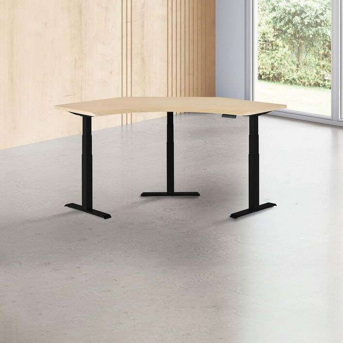 light wood finish standing desk top with black finish legs in a open office image number 0
