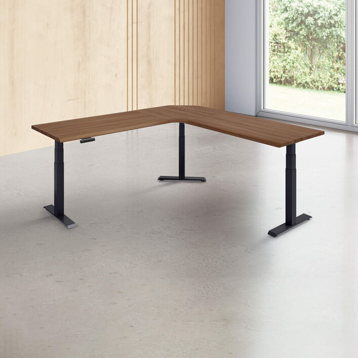 L-shape desk with a walnut finish desk top with black legs in a open office image number 0