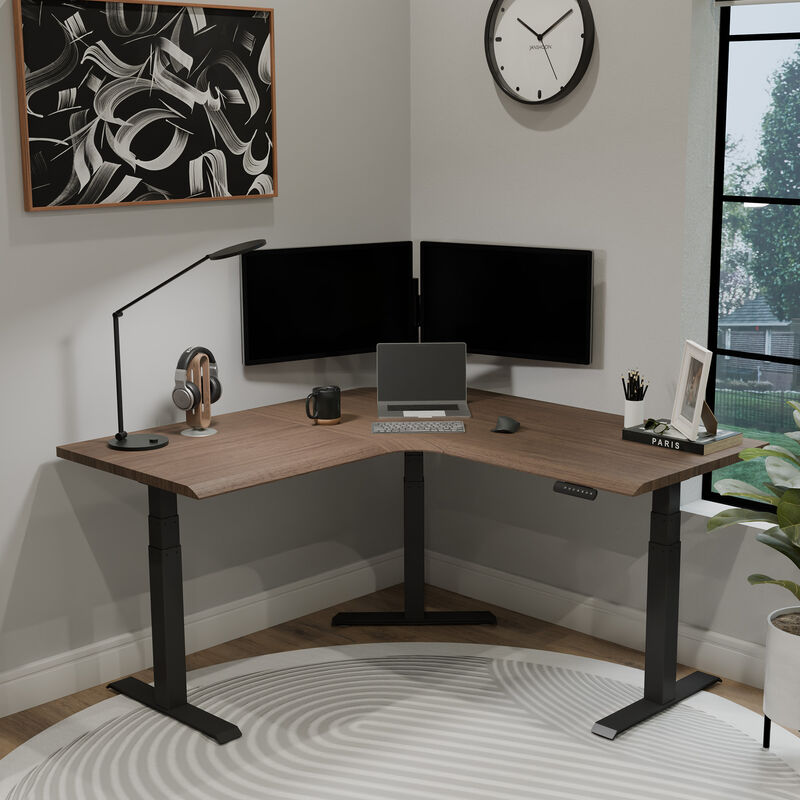 walnut finish l shape electric standing desk in a lowered position in the corner of a workspace image number null
